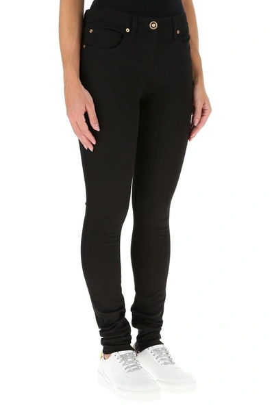 Shop Versace Low Rise Skinny Jeans In Black