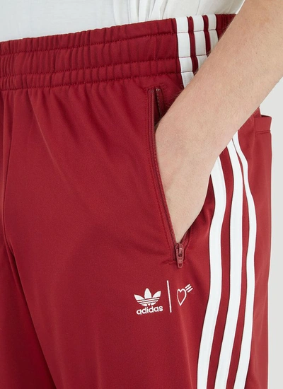 Shop Adidas By Human Made Firebird Track Pants In Red