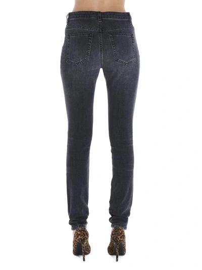 Shop Saint Laurent Ripped Skinny Jeans In Black