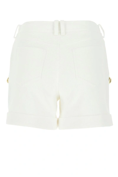 Shop Balmain Button Embellished Shorts In White