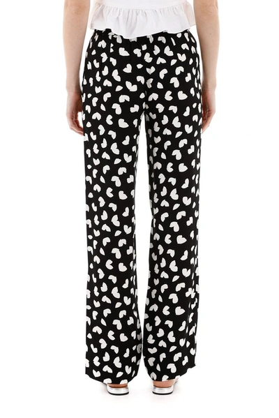 Shop Michael Michael Kors Petal Passion Print Trousers In Multi