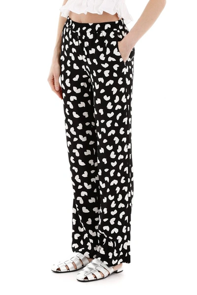 Shop Michael Michael Kors Petal Passion Print Trousers In Multi