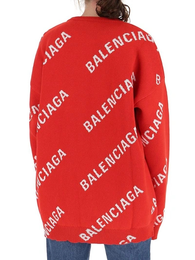 Shop Balenciaga All Over Logo Knit Sweater In Red