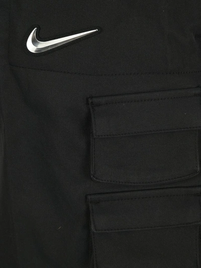 Shop Nike Swoosh Mini Skirt In Black