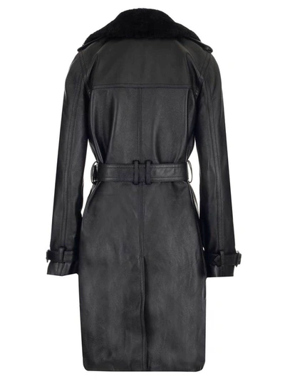 Shop Saint Laurent Belted Leather Trench Coat In Black