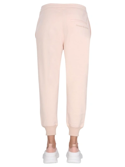 Shop Alexander Mcqueen Logo Embroidered Jogging Pants In Pink