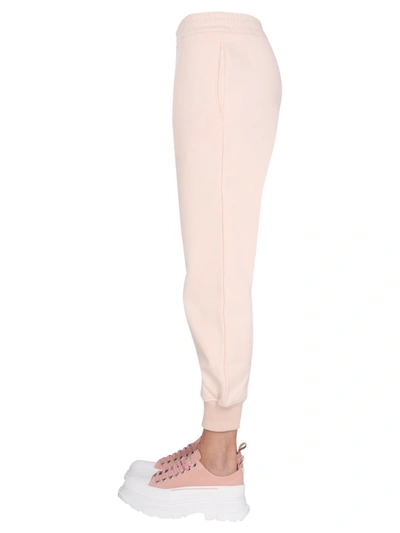 Shop Alexander Mcqueen Logo Embroidered Jogging Pants In Pink