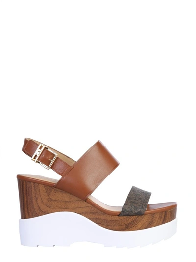 Shop Michael Michael Kors Rhett Monogram Wedge Sandals In Brown
