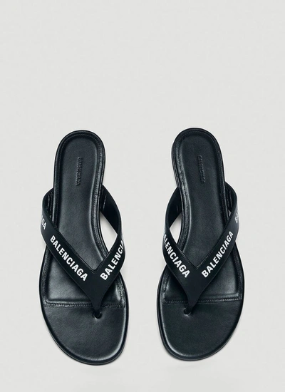 Shop Balenciaga Allover Logo Flip Flops In Black
