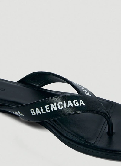 Shop Balenciaga Allover Logo Flip Flops In Black