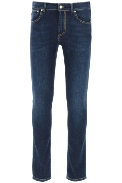 Shop Alexander Mcqueen Jeans With Logo Embroidery In Blu Washed (blue)