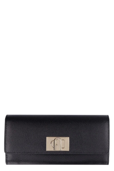 Shop Furla 1927 Leather Continental Wallet In Black