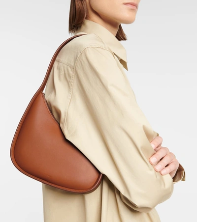 Shop The Row Half Moon Small Leather Shoulder Bag In 棕色
