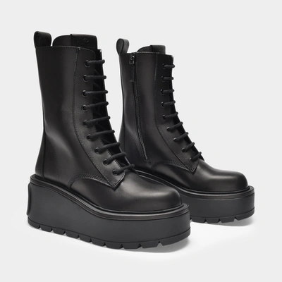 Shop Valentino Combat Boots In Black