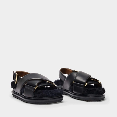 Shop Marni Fussbet Sandals In Black Leather And Shearling