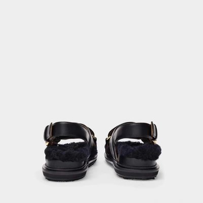 Shop Marni Fussbet Sandals In Black Leather And Shearling