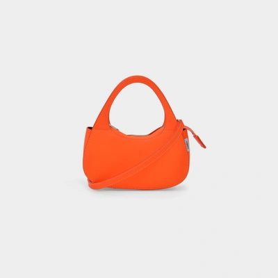Shop Coperni Micro Baguette Swipe Bag In Orange