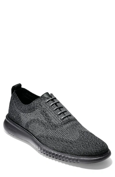 Shop Cole Haan 2.zerogrand Stitchlite Water Resistant Wingtip In Black/ Magnet/ Black