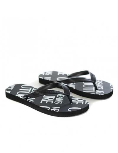 Shop Versace Jeans Couture Flip Flops With All Over L In Black