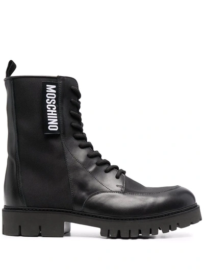 Shop Moschino Logo-patch Ankle Boots In Schwarz