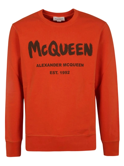 Shop Alexander Mcqueen Graffiti Print Sweatshirt In Orange/khaki