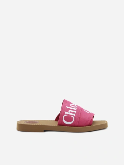 Shop Chloé Woody Sandals In Canvas With Contrasting Logo Print In Pink