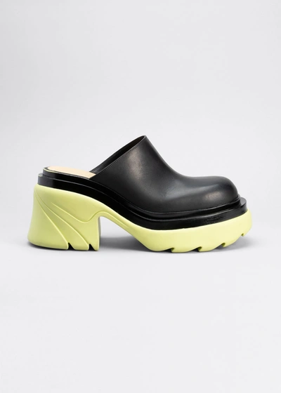 Shop Bottega Veneta Calfskin Contrast-sole Mules In Nerotrufl