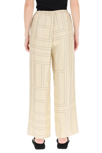 Shop Totême Toteme Monogram Embroidered Pajama Trousers In Mixed Colours