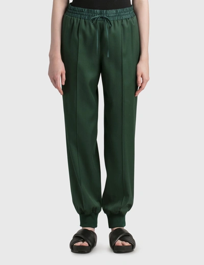 Shop Jil Sander Wool Tapered Joggers In Green