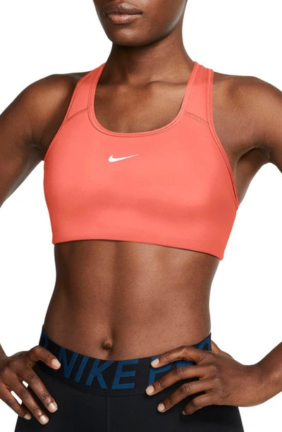 Shop Nike Swoosh Dri-fit Racerback Sports Bra In Bright Mango/ White