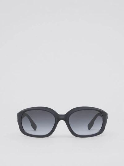 Shop Burberry Oval Frame Sunglasses In Black