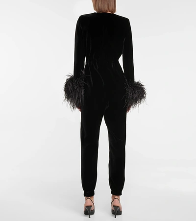 Shop Saint Laurent Feather-trimmed Velvet Jumpsuit In Black