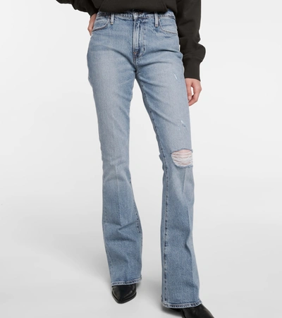 Shop Frame Le High Flare Distressed Jeans In Blue