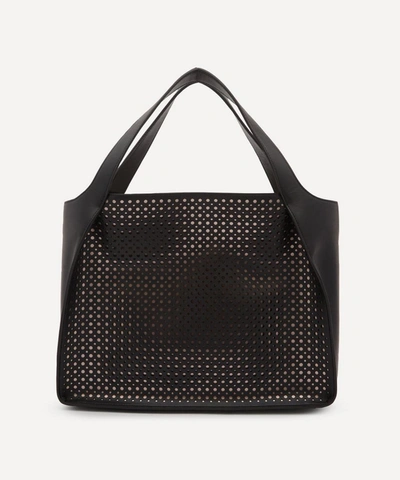 Shop Stella Mccartney Stella Logo Perforated Faux Leather Tote Bag In Black
