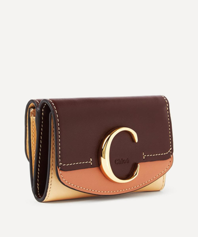 Shop Chloé Chloe C Small Leather Tri-fold Wallet In Dusky Brown