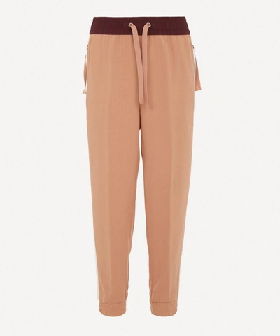 Shop Moncler Satin Tapered Trousers In Pink