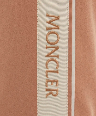 Shop Moncler Satin Tapered Trousers In Pink