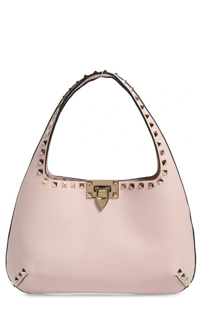 Shop Valentino Small Rockstud Leather Handbag In Rose Quartz