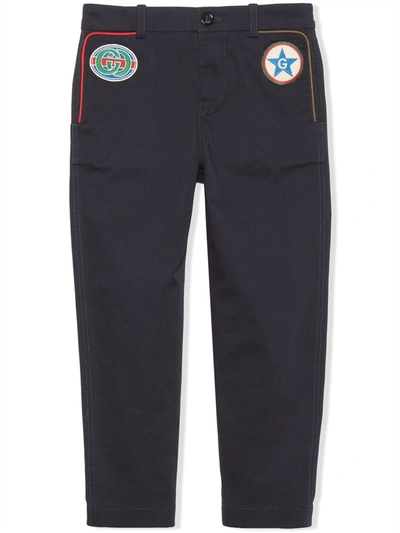 Shop Gucci Stretch-gabardine Star Patch Trousers In Blue