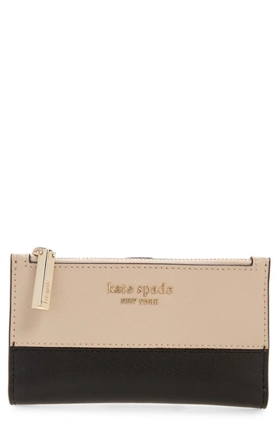 Shop Kate Spade Small Spencer Slim Leather Bifold Wallet In Warm Beige/ Black