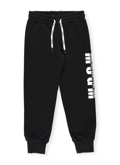 Shop Msgm Cotton Trackpants In Black