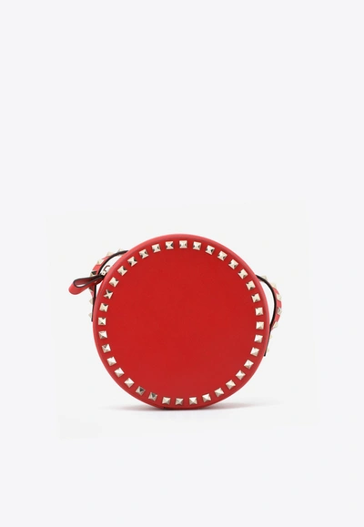 Shop Valentino Rockstud Round Crossbody Bag In Calfskin In Red