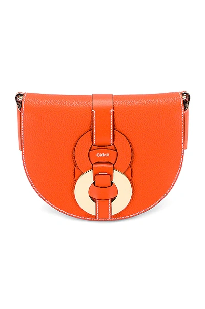 Shop Chloé Darryl Saddle Crossbody Bag In Radiant Orange