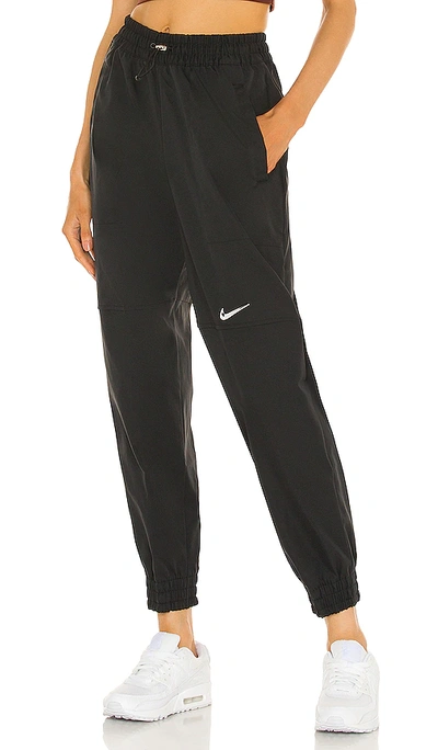 Shop Nike Woven Swoosh Pant In Black