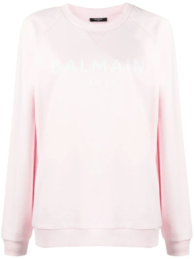 Shop Balmain Logo-print Long-sleeve Sweatshirt In 粉色