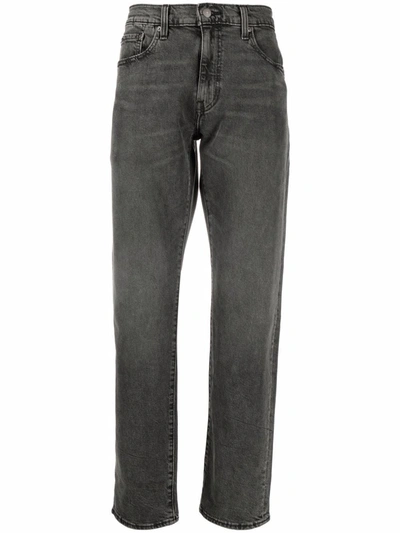 Shop Levi's 502 Tapered Jeans In 黑色