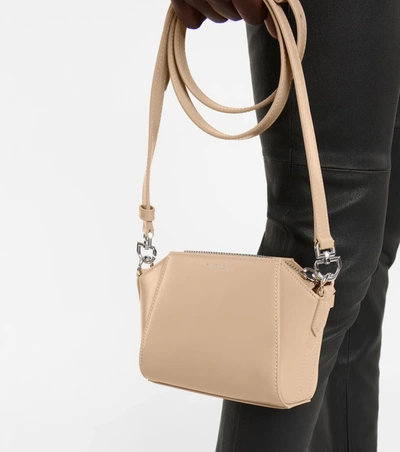 Shop Givenchy Antigona Nano Leather Shoulder Bag In 米色