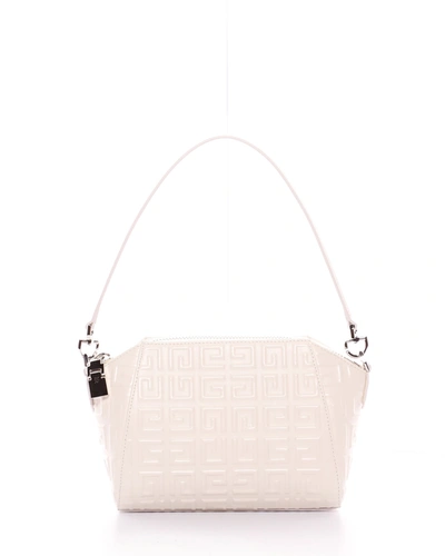 Shop Givenchy Antigona Xs Logo-embossed Leather Shoulder Bag In 105 Ivory