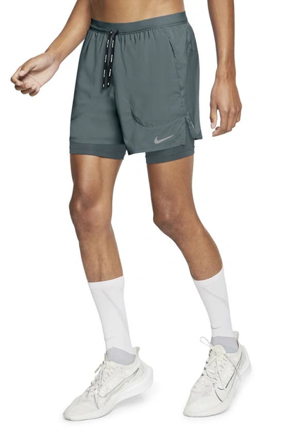 Shop Nike Dri-fit Flex Stride Pocket 2-in-1 Running Shorts In Hasta/ Hasta