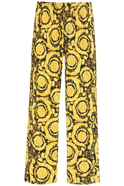Shop Versace Baroque Print Pajama Trousers In Gold Print (black)